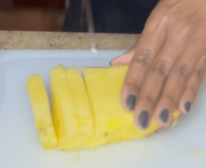 slicing pineapples