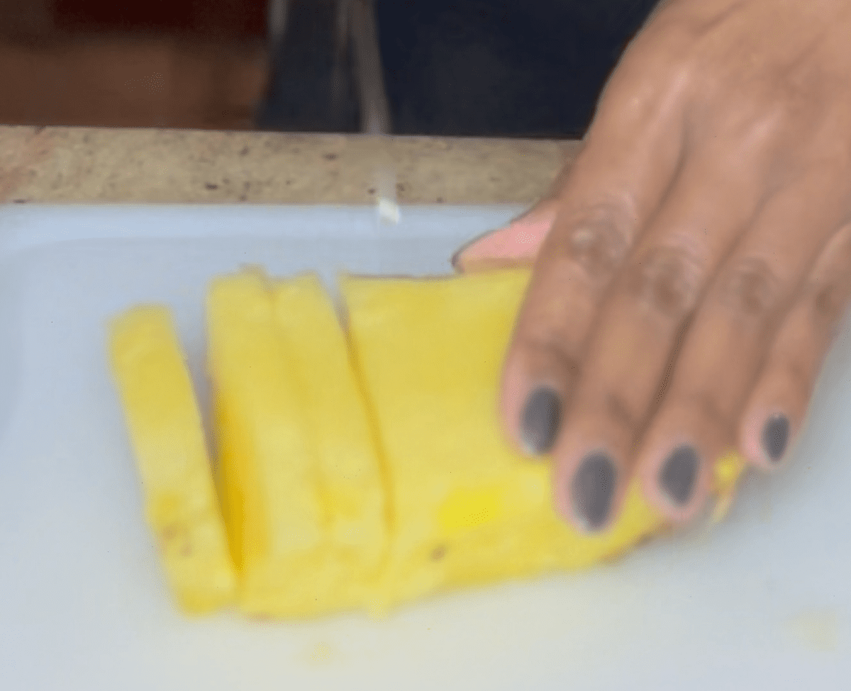 slicing pineapples